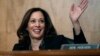 FILE - Sen. Kamala Harris, D-Calif., waves to another member of the committee during a hearing on Capitol Hil in Washington, Oct. 3, 2018. 