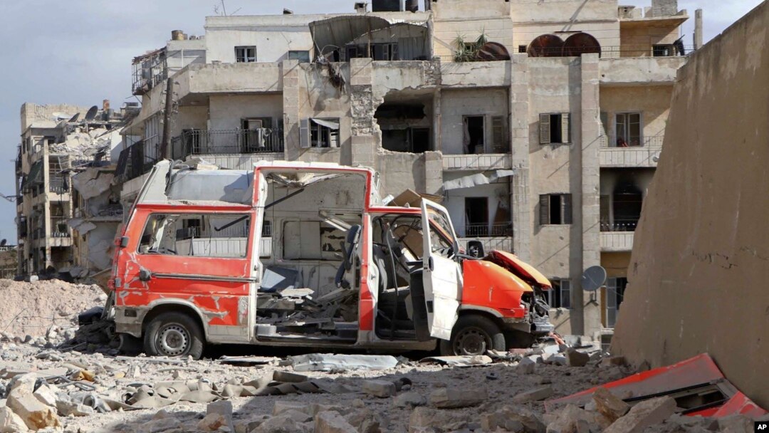 In this photo provided by the Syrian Civil Defense group known as the "White Helmets," a destroyed ambulance is seen in the Ansari neighborhood in the rebel-held part of eastern Aleppo, Syria, Sept. 23, 2016.