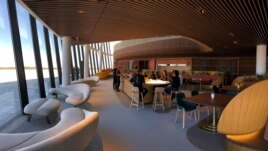 Virgin Galactic employees gather at the coffee bar that serves as the heart of the company's social hub where they will meet with customers and their families at Spaceport America. (AP Photos/Susan Montoya Bryan)