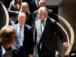 FILE - Secretary of State Rex Tillerson, right, and Defense Secretary Jim Mattis arrive on Capitol Hill in Washington, Aug. 2, 2017, for a hearing before the Senate Foreign Relations Committee.