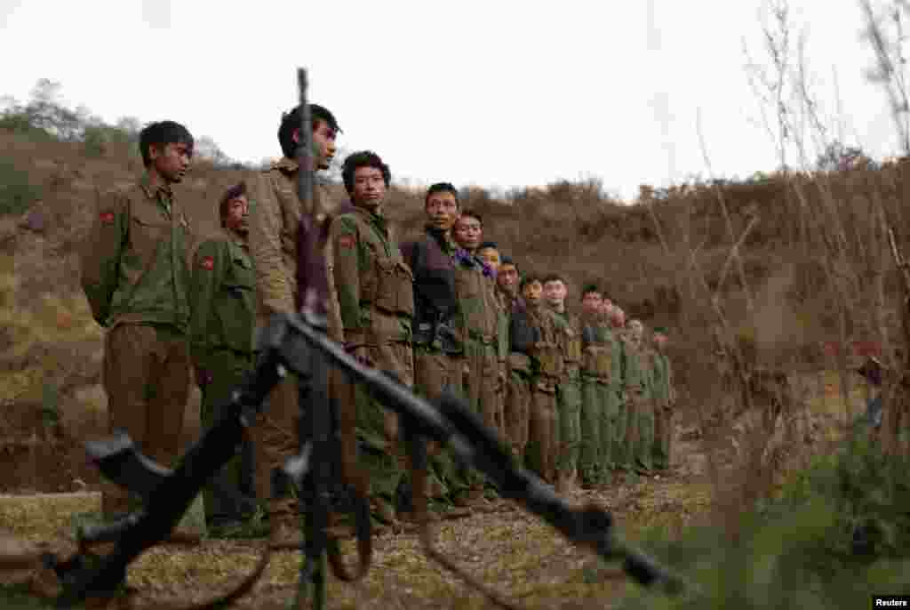 Rebel soldiers of Myanmar National Democratic Alliance Army (MNDAA) gather at a military base in Kokang region, March 11, 2015. Myanmar government forces have been battling rebels on the border with China since last month and China has urged Myanmar to &quot;lower the temperature&quot;. The MNDAA was formed from remnants of the Communist Party of Burma, a powerful China-backed guerrilla force that battled the Myanmar government until it splintered in 1989.