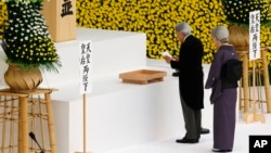 Japan's Emperor Akihito delivers his remarks with Empress Michiko during a memorial service at Nippon Budokan martial arts hall in Tokyo, Aug. 15, 2017. Japan marked the 72nd anniversary of its World War II surrender. 