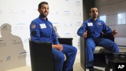 Emirati astronauts Sultan al-Neyadi, left, and Hazza al-Mansoori, are interviewed by The Associated Press in Dubai, United Arab Emirates, Monday, Feb. 25, 2019. 