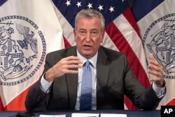 FILE - New York Mayor Bill de Blasio speaks during a virtual press conference in New York, Dec. 2, 2021, in this image taken from video.