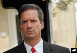 FILE - Mark Green, director of the U.S. Agency for International Development, is pictured at the U.S. Embassy in Tanzania, Aug. 7, 2008, when he was U.S. ambassador to that country.