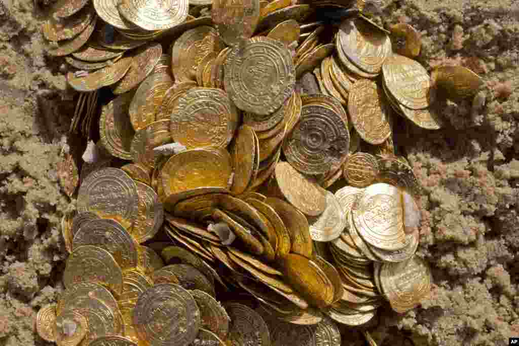 Fatimid period gold coins were found in the seabed in the Mediterranean Sea near the port of Caesarea National Park in Caesarea, Israel. A group of amateur Israeli divers have stumbled upon the largest collection of medieval gold coins ever found in the country, dating back to the 11th century and likely from a shipwreck in the Mediterranean Sea.