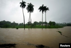 Una granja parcialmente inundada en Bahía Honda, Cuba, cuando la tormenta subtropical Alberto pasaba por la costa oeste de la Isla. 26 de mayo de 2018. REUTERS / Alexandre Meneghini.