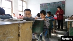 Students attend class at Pengying School on the outskirts of Beijing, Nov. 11, 2013.