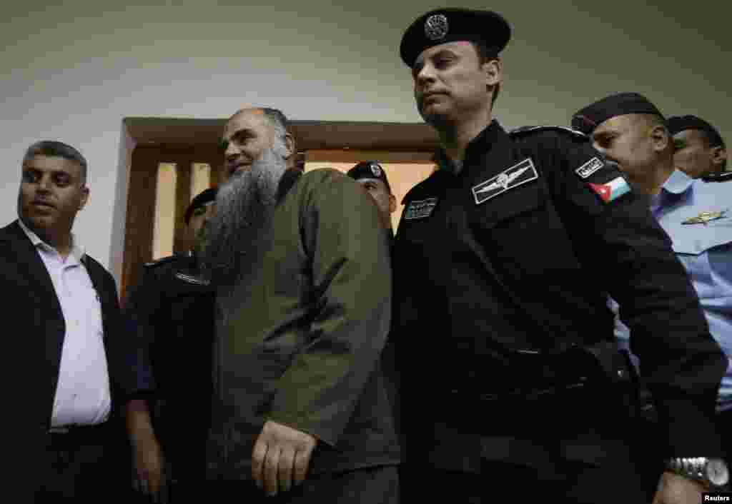 Abu Qatada arrives at the State Security Court in Amman, Sept. 24, 2014.