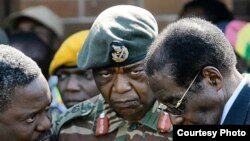 President Roberty Mugabe consulting some members of the Joint Operations Command in Harare