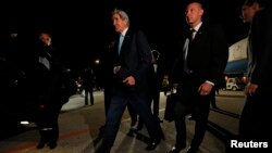 U.S. Secretary of State John Kerry is surrounded by security as he arrives in Geneva, April 16, 2014.