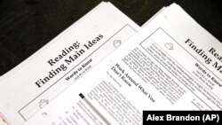 FILE - Some American universities are requiring students to send their SAT and ACT scores after a "test-optional" period. (AP Photo)