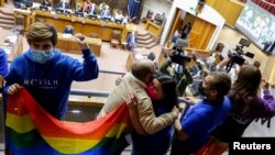 People react during a session of the Senate to approve a same-sex marriage bill in Valparaiso, Chile, Dec. 7, 2021. 