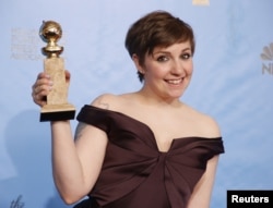FILE - "Girls" creator and actress Lena Dunham poses with the award "Girls" won for Best Televison Series, Comedy or Musical at the 70th annual Golden Globe Awards in Beverly Hills, California, Jan. 13, 2013.