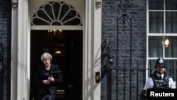 Britain's Prime Minister Theresa May prepares to speak outside 10 Downing Street after an attack on London Bridge and Borough Market left 7 people dead and dozens injured in London, Britain, June 4, 2017.