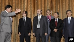 Mikhail Margelov, the Kremlin's Mideast envoy, left, welcomes a Syrian opposition delegation led by Washington-based rights activist Radwan Ziadeh, second from left, 28 June 2011.