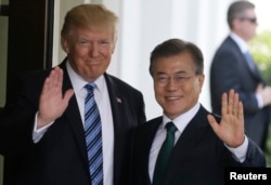 FILE - U.S. President Donald Trump, left, welcomes South Korean President Moon Jae-in at the White House in Washington, June 30, 2017.