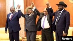 From right, South Sudan's President Salva Kiir, Sudan's President Omar Al-Bashir, Uganda's President Yoweri Museveni and rebel leader Riek Machar hold hands during a South Sudan peace meeting in Khartoum, Sudan, June 25, 2018. 