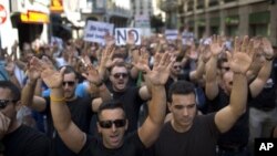 Demonstrators protest in Madrid, Spain, July 16, 2012