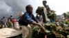 A boy sells Cassava leaves at a market in Bunagana, eastern Democratic Republic of Congo, Oct. 19, 2012.