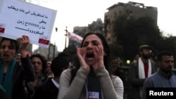 A woman shouts slogans against Egyptian President Mohamed Morsi and members of the Brotherhood during a march against sexual harassment and violence against women in Cairo, Feb. 6, 2013.