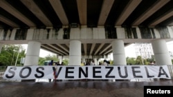 A banner is seen outside the site where the Organization of American States 47th General Assembly is taking place in Cancun, Mexico June 21, 2017. 