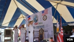 Commodore Ramon Joseph Mercado, Philippines exercises commander, Rear Admiral Jaime Bernardino, Philippine Fleet Commander and Rear Admiral Stuart Munsch, U.S. Commander of Submarine Group 7 stand to attention during opening rites of the joint naval exerc