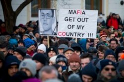 People march in silent protest in memory of murdered journalist Jan Kuciak and his girlfriend Martina Kusnirova in Bratislava, Slovakia, Feb. 28, 2018. In the wake of an unprecedented slayings of an investigative journalist and his fiancee, Slovaki
