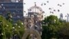 FILE - Doves fly by the Atomic Bomb Dome during the ceremony to mark the 61st anniversary of the world's first atomic bombing at Hiroshima Peace Memorial Park in Hiroshima, western Japan, Aug, 6, 2006 (AP)