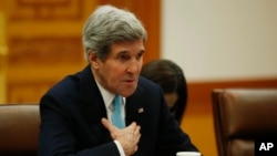 U.S. Secretary of State John Kerry talks with South Korean President Park Geun-hye during their meeting at the Blue House in Seoul on Feb. 13, 2014.