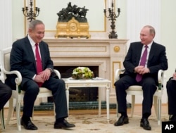 Russian President Vladimir Putin, right, meets with Israeli Prime Minister Benjamin Netanyahu in Moscow, Russia, March 9, 2017. Russia, according to an analyst, now faces the daunting task of having "to get along with both Iran and Israel!”