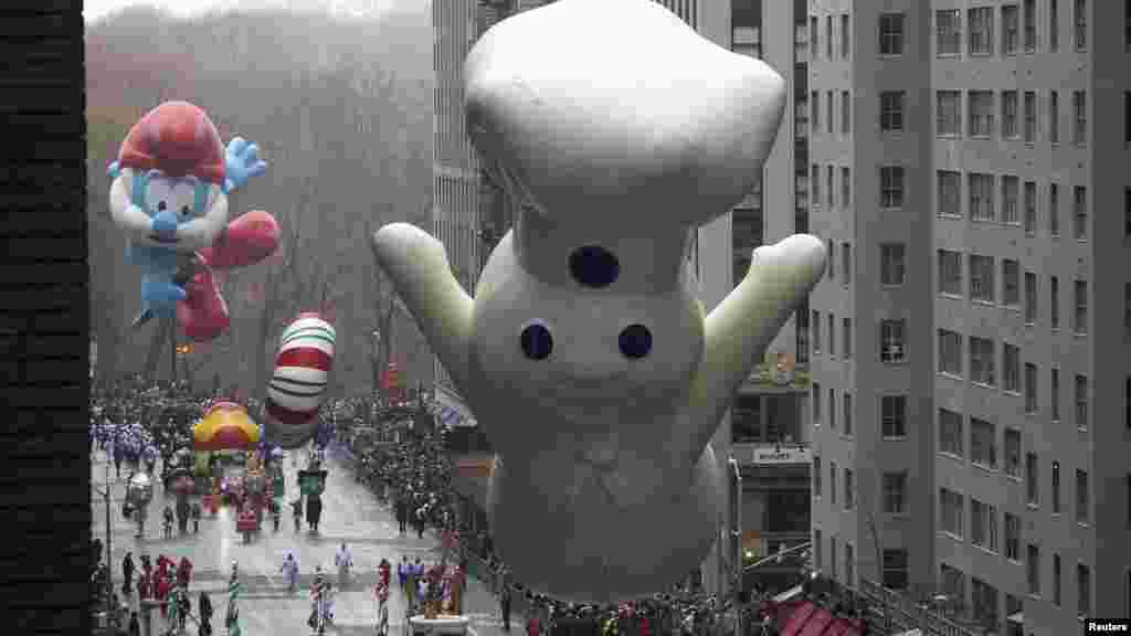 The Pillsbury Doughboy float makes its way down Sixth Avenue during the Macy's Thanksgiving Day Parade in New York, Nov. 27, 2014. 