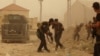 Security forces defend their headquarters against attacks by Islamic State extremists during sand storm in the eastern part of Ramadi, the capital of Anbar province, 115 kilometers (70 miles) west of Baghdad, Iraq, May 14, 2015.Iraq Islamic State