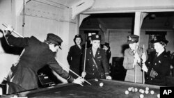  Members of the British and American womens services gather around pool table in the recreation hall at Allied Headquarters in England, May 24, 1944. (AP Photo)