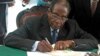 Mugabe Signs New Zimbabwe Constitution Into Law