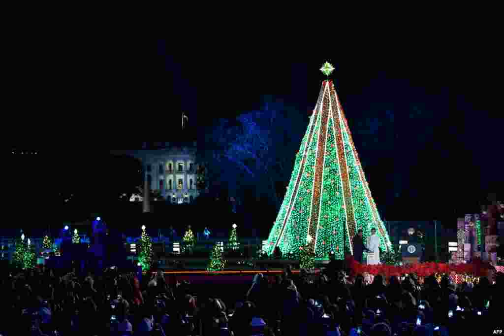 American President Donald Trump, and first lady Melania Trump light the National Christmas Tree on the National Mall in Washington, D.C., November 28, 2018.