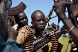 FILE - South Sudan government soldiers in the town of Koch, Unity state, South Sudan.