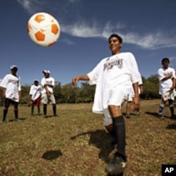 Members of Nicaragua's Buena Vista soccer team, a local soccer team, train after receiving T-shirts with graphics depicting the New England Patriots NFL team as the winners of Super Bowl XLII, in San Gregorio village, south of Managua. The NFL donated the