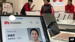 FILE -- A profile of Huawei Chief Financial Officer Meng Wanzhou is displayed on a Huawei computer at a Huawei store in Beijing, Dec. 6, 2018.