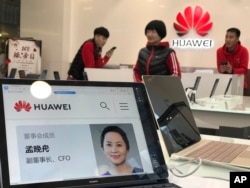 A profile of Huawei's chief financial officer Meng Wanzhou is displayed on a Huawei computer at a Huawei store in Beijing, China, Dec. 6, 2018.