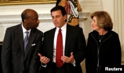 Ford Motor Company CEO Mark Fields, center, is flanked by Merck & Co. CEO Ken Frazier and Campbell's CEO Denise Morrison at a meeting held by President Donald Trump with manufacturing CEOs at the White House in Washington, Feb. 23, 2017.
