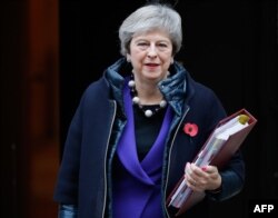 Britain's Prime Minister Theresa May leaves 10 Downing Street in London on Oct. 31, 2018, ahead of the weekly Prime Minister's Questions session in the House of Commons.