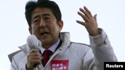 Japan's main opposition Liberal Democratic Party's (LDP) leader and former Prime Minister Shinzo Abe makes a speech during a campaign for the December 16 lower house election in Ageo, north of Tokyo, December 11, 2012. 
