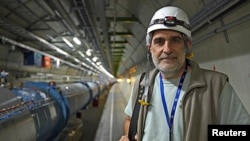 Simon Baird, deputy head of CERN's engineering department, poses in the LHC tunnel during a visit at the Organization for Nuclear Research (CERN) in Meyrin, near Geneva, April 10, 2013. 
