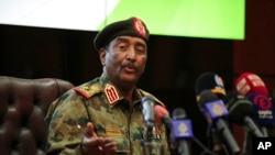 FILE - Sudan's head of the military, Gen. Abdel-Fattah Burhan, speaks during a press conference at the General Command of the Armed Forces in Khartoum, Sudan, Oct. 26, 2021.