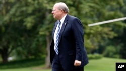 White House Deputy Chief of Staff for Operations Joe Hagin walks to the White House as he arrives on the South Lawn, Aug. 14, 2017, in Washington. 