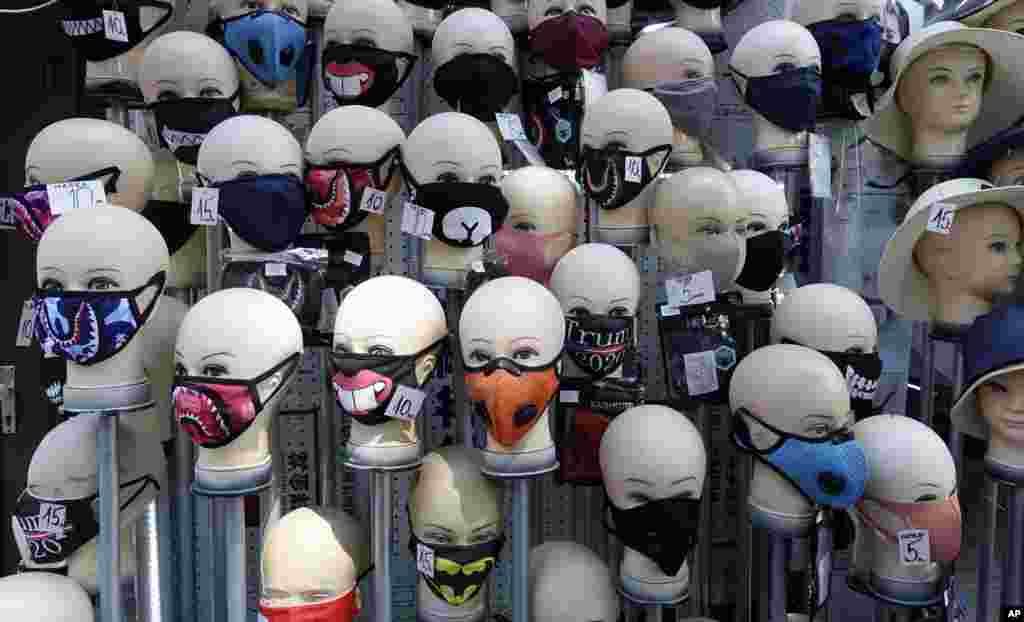 Masks placed on mannequins heads are displayed outside a shop in Sarajevo&#39;s main street, Bosnia.