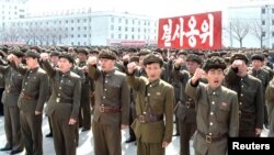 North Koreans attend a rally against the United States and South Korea in Nampo, April 3, 2013.