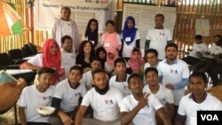 Teachers gather with VOA Learning English instructor at the end of training.