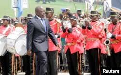Democratic Republic of the Congo President Joseph Kabila inspects a guard of honor during the anniversary celebrations of the DRC's independence from Belgium in Kindu, DRC, June 30, 2016.